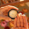 8 Days Botanicals Joy Body Butter - Model shown holding open jar