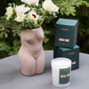 ROEN Candles Hotel Flori Scented Candle - Beauty shot product shown next to flowers in vase