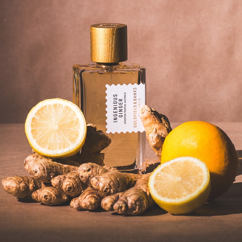 Goldfield & Banks Ingenious Ginger Perfume - Life style photo with ginger and lemons and perfume bottle