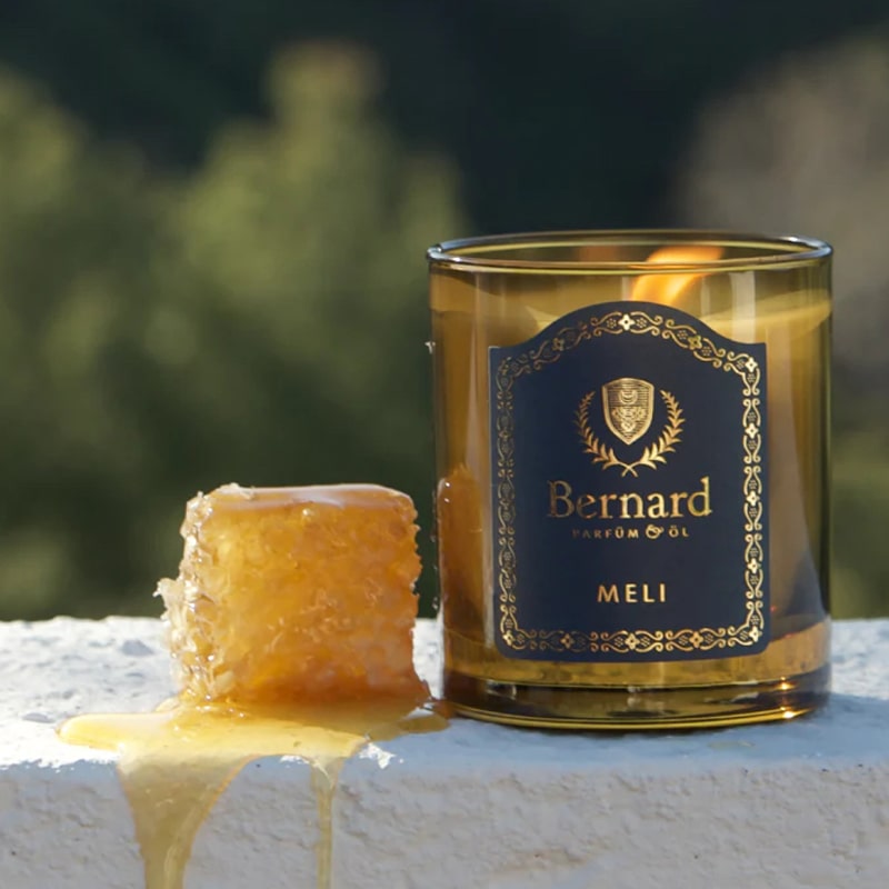 Bernard Parfum Meli Candle - product with honey lifestyle photo