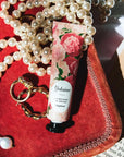 Yolaine La Mousse de Rouge - Daphne- Beauty shot - Product shown on velvet tray with jewelry