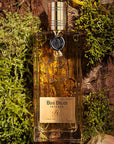 Parfums de Nicolai Bois Belize Intense Eau de Parfum - Beauty shot, product shown with wood and moss