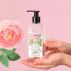 Fragonard Parfumeur Micellar Water (250 ml)  - product shown being held on pink background. 