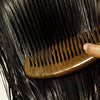 Roz Willow Glen Treatment Oil - Model shown combing product through hair