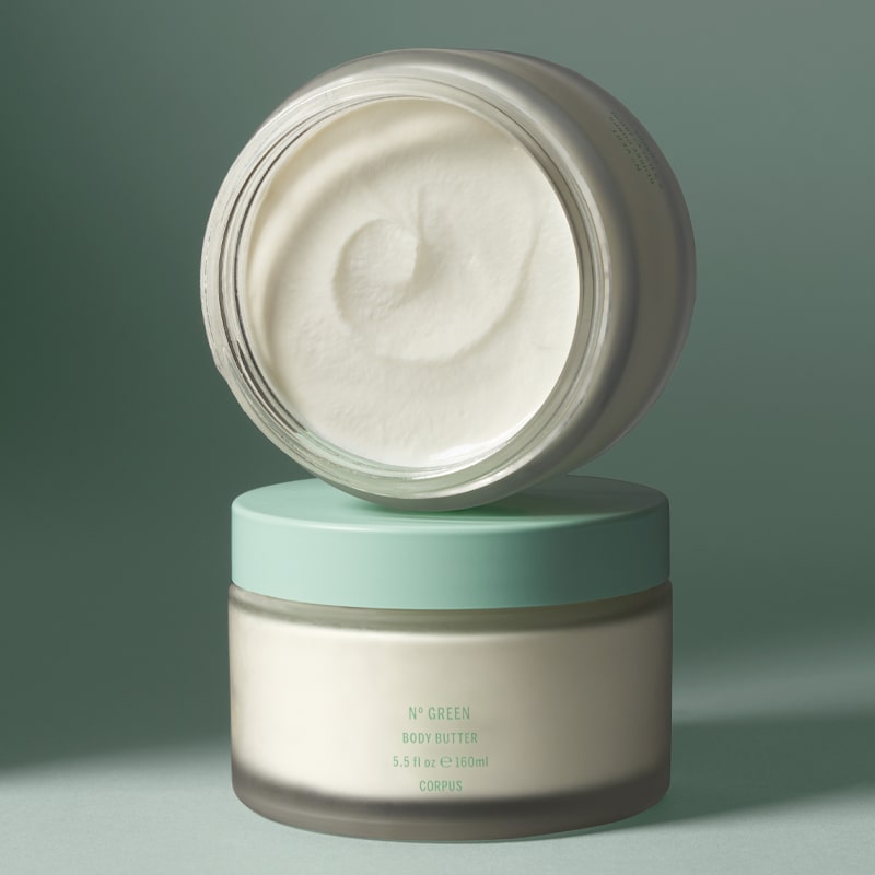 Corpus No. Green Body Butter - Open jar showing body butter texture on top of closed container