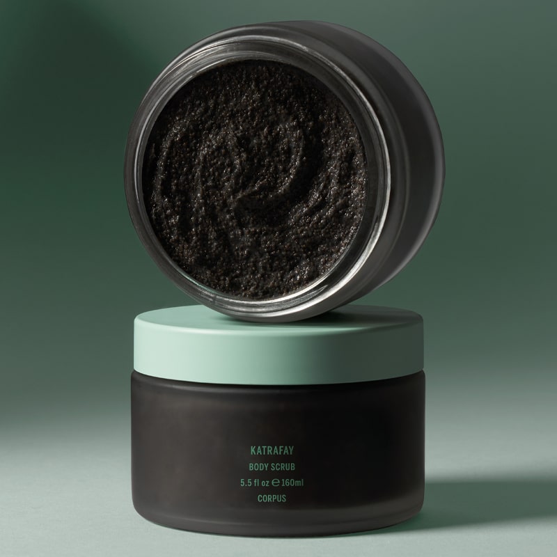 Corpus Katrafay Body Scrub - Lifestyle photo of two containers on top of each other showing texture