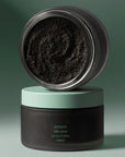 Corpus Katrafay Body Scrub - Lifestyle photo of two containers on top of each other showing texture