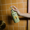 Wonder Valley Hinoki Body Wash- Model shown dispensing product
