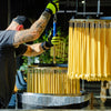 Bluecorn Beeswax Hand-Dipped Beeswax 8" Taper Candles displayed being made
