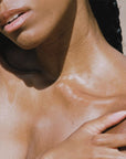 FORAH Dayglow Oil Serum - Models chest shown with product applied