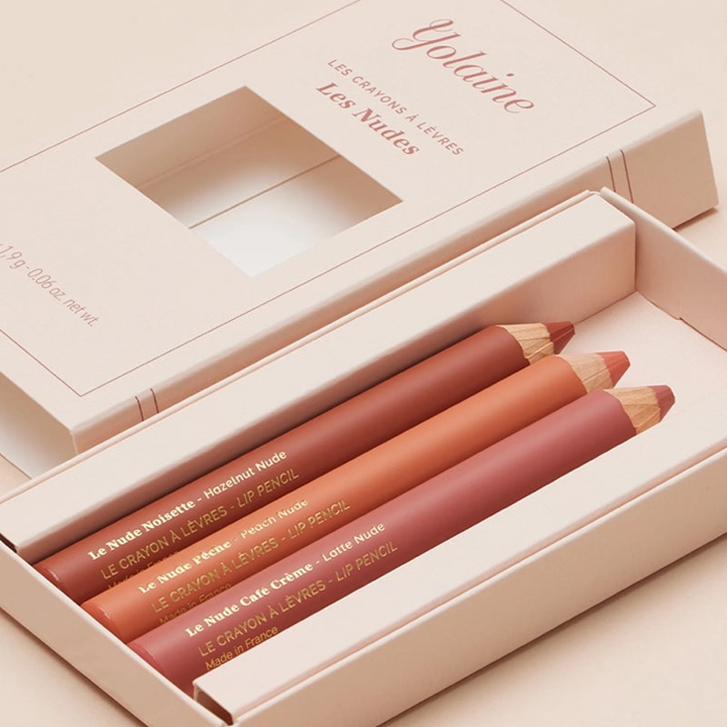 Yolaine The Nude Lip Pencils - Lifestyle photo of packaging and pencils