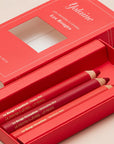 Yolaine The Red Lip Pencils - lifestyle photo of open package of lip pencils