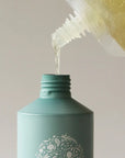 Roz Foundation Shampoo (600 ml Refill) - Product shown being poured into bottle