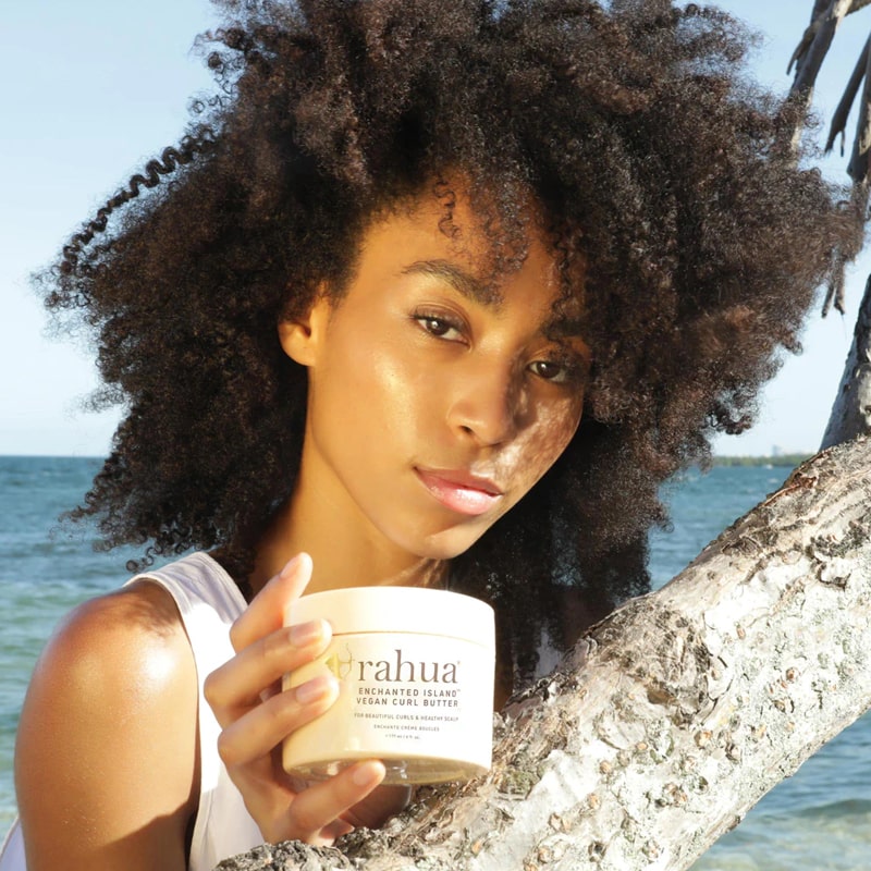 Rahua by Amazon Beauty Enchanted Island Vegan Curl Butter - Beauty shot, Model shown holding product