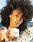 Rahua by Amazon Beauty Enchanted Island Vegan Curl Butter - Beauty shot, Model shown holding product