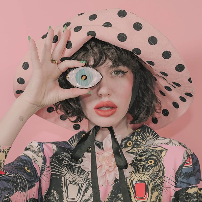 Coucou Suzette Blue Eye Mirror  - Model shown holding product in front of eye