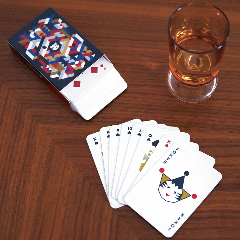 Papier Tigre Playing Cards - cards, packaging and glass on wood table