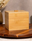 Clean Skin Club Luxe Bamboo Box with Cover - Product displayed on wood table