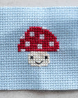Marvling Bros Ltd Kawaii Toadstool Mini Cross Stitch Kit In A Matchbox - Finished product shown on gray background