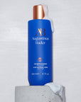 Augustinus Bader The Body Cleanser - Product displayed on stone