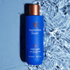 Augustinus Bader The Body Cleanser Beauty shot, product shown next to water