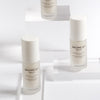 Cosmetics 27 Baume 27 Advanced Regeneration Serum - lifestyle photo of bottles on clear blocks