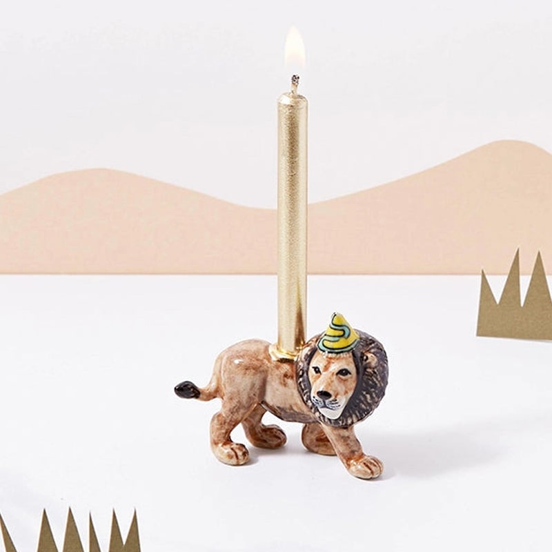Camp Hollow Lion Party King Cake Topper - Product shown with candle