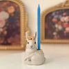 Camp Hollow Royal White Rabbit Cake Topper - Product displayed with candle