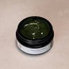 ISUN Emerald Algae Face Mask (50 ml) with lid off showing color and texture of product inside