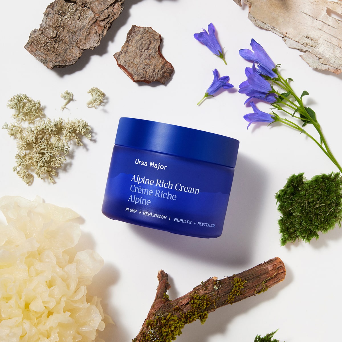 Ursa Major Alpine Rich Cream (50 ml) - product shown with flowers and tree bark