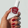 Tenoverten Nail Polish - Carmine - model holding nail polish bottle