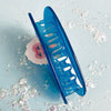 Centinelle Snow Monkey Hair Claw - bottom view of hair claw on table with glitter flakes