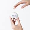 Baume 27 Advanced Formula Advanced Repair Rich Cream (50 ml) - product shown being held by hands. 