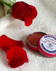 C.O. Bigelow Rose Salve Tin - No. 012 - Beauty shot, product shown with rose and petals