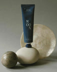 3rd Ritual Moon Botanical Body Lotion - Beauty shot, product shown on top of stone