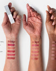 Flyte.70 S+S.LipSheer Tinted Lipstick Balm showing all colors on models' arms of different skin tones.