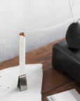 Kunjudo Washi Paper Incense Strips - Elegant Agarwood - lifestyle photo of incense burning in metal clip, and stone platform on wood table