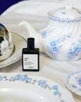 Versatile Paris Culot The (Tea Cap) Extrait de Parfum shown with tea set