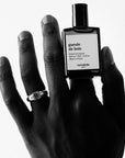 Versatile Paris Gueule de Bois (Hangover) Extrait de Parfum in a model's hand