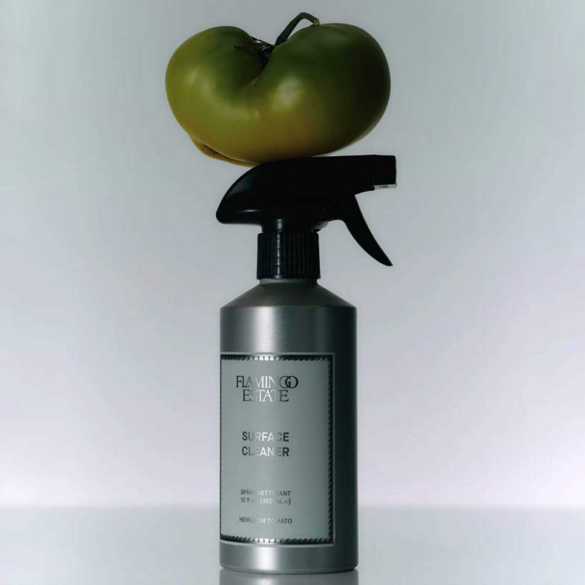 Roma Heirloom Tomato Surface Cleaner (355 ml) product shown with tomatoes on top.