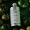 Flamingo Estate Organics Roma Heirloom Tomato Dish Soap (355 ml) - product shown next to tomatoes.