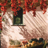 Flamingo Estate Organics Roma Heirloom Tomato Dish Soap (355 ml) - courtyard shown.