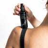 Kahina Giving Beauty Toning Mist- Model shown holding product on top of shoulder