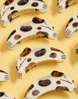 Winona Irene Tortie Puppy Hair Claw - Products shown on yellow background
