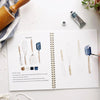 Emily Lex Studio Baking Watercolor Workbook - Model shown painting baking utensils