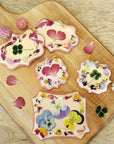 Umami Insider Pressed Dried Edible Flowers- Product shown on cookies