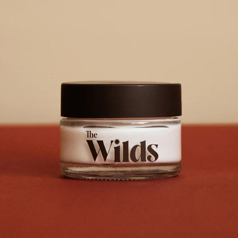 The Wilds Daydream Day Cream - Product shown on red background