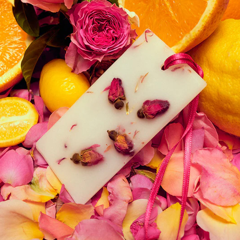 Santa Maria Novella Rosa Novella Scented Wax Tablets - Beauty shot, product shown on top of fruit and flowers
