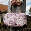 Fable England Large Bowling Bag - Plum Rambling Floral- Model shown holding product