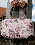 Fable England Large Bowling Bag - Plum Rambling Floral- Model shown holding product